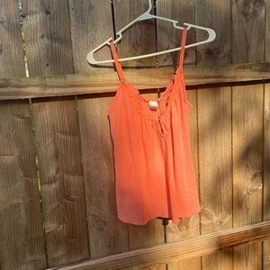 Roxy, blousy tank top, small but not a tight tank top.